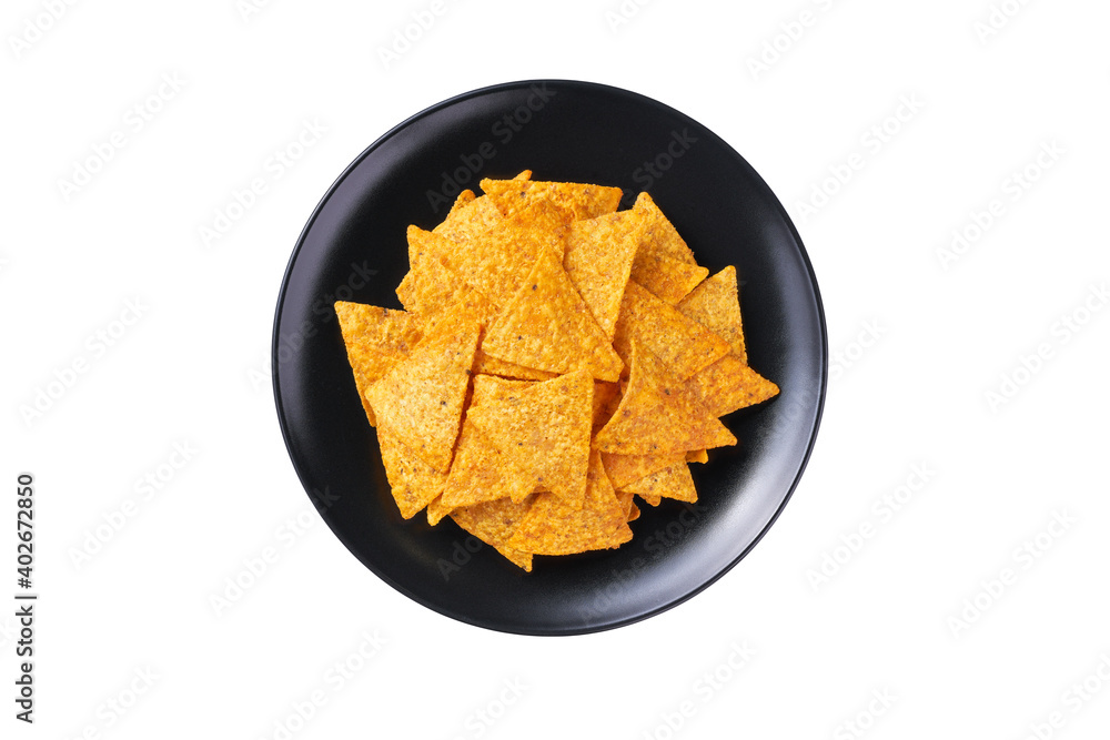 mexican nachos chips on a black plate isolated on a white background, top view. mexican nachos chips on a black plate isolated on a white background, top view.