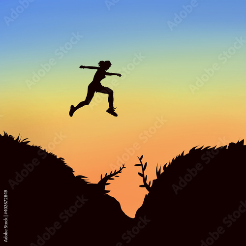 silhouette of jumping girl from the peak of mountain .
