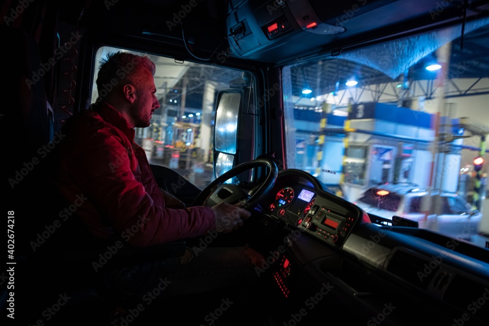 Truck driver at work. Truck driver profession.