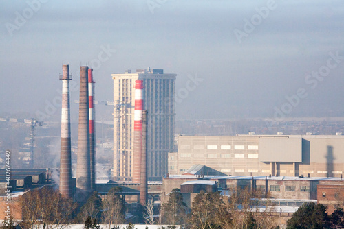 Factory pipes in the afternoon in winter in December in Novosibirsk