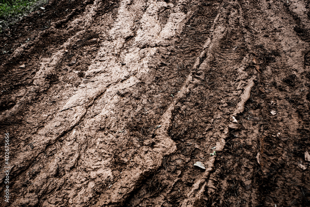 Tyre track on dirt sand or mud, Picture in retro or grunge tone. Car drive on sand. off road track. Track on grass field. Track in farm. Tyre track on dirt sand or mud, Picture in retro or grunge tone. Car drive on sand. off road track. Track on grass field. Track in farm.