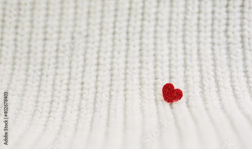 happy valentine day.Red heart.shiny red heart on a white knit background