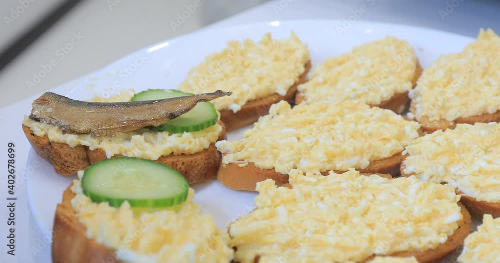 Sandwiches are made from white bread in the kitchen Sandwiches are made from white bread in the kitchen