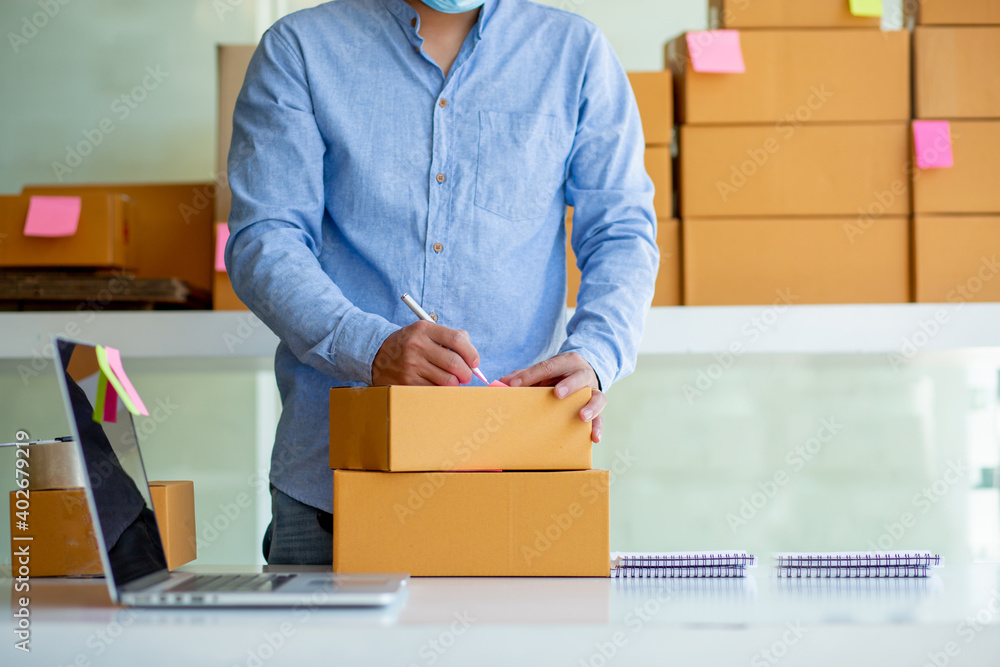 A small business owner in home office,Start a small business, an independent SME entrepreneur working with a box, package delivery, online marketing, SME e-commerce concept, A small business owner in home office,Start a small business, an independent SME entrepreneur working with a box, package delivery, online marketing, SME e-commerce concept,