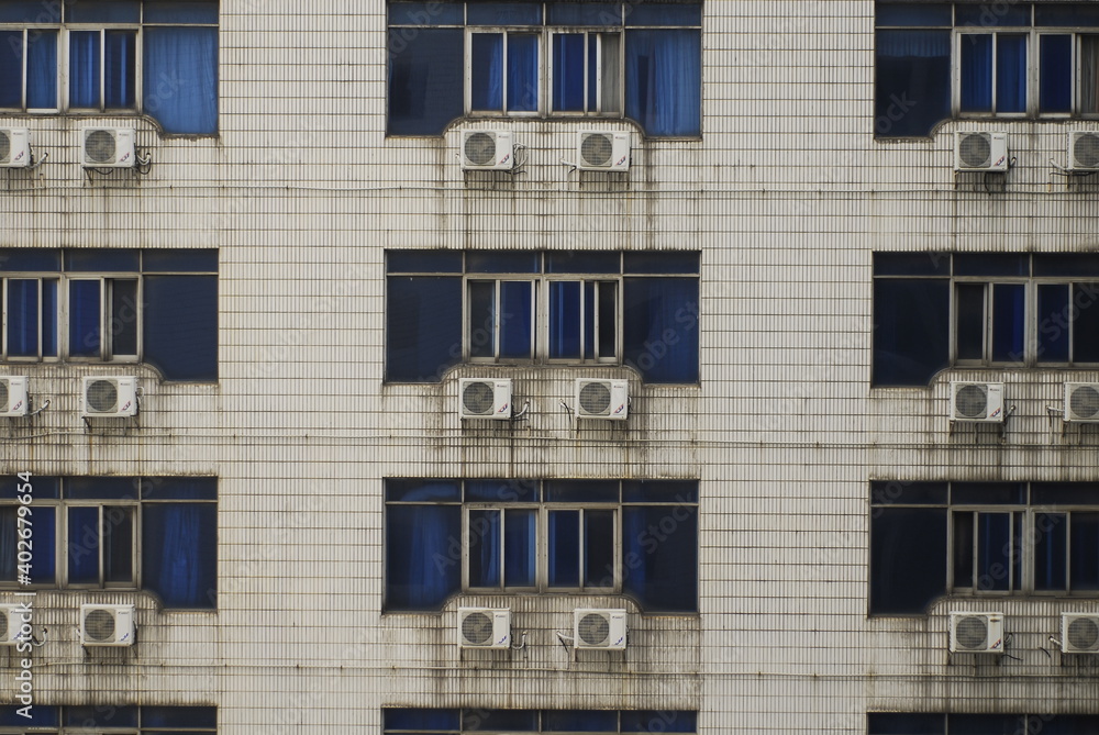 An old building covered with air conditioners in China