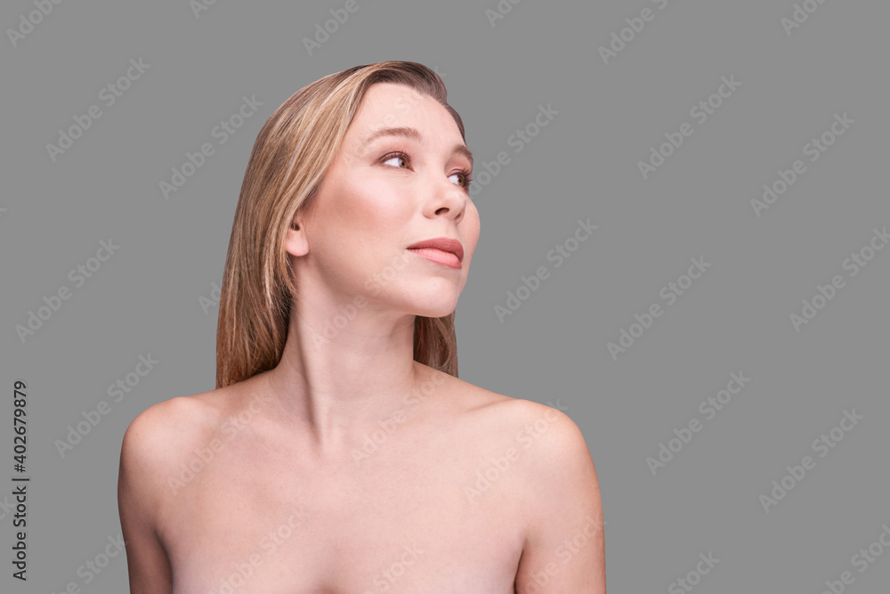 © elenavolf - Cosmetology concept. Skin care product. Female portrait. Face mask. Home peeling. Grey background. Copyspace. Facial lifting treatment. Dermatology beauty model. Side view © elenavolf - Cosmetology concept. Skin care product. Female portrait. Face mask. Home peeling. Grey background. Copyspace. Facial lifting treatment. Dermatology beauty model. Side view