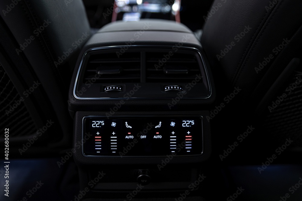 Rear seat air conditioning control panel in modern luxury car 