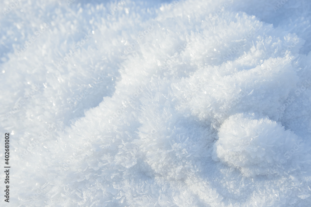 Hoarfrost background texture. Fresh ice and snow winter backdrop with snowflakes and mounds. Seasonal wallpaper. Frozen water geometrical shapes and figures. Cold weather atmospheric precipitation. Hoarfrost background texture. Fresh ice and snow winter backdrop with snowflakes and mounds. Seasonal wallpaper. Frozen water geometrical shapes and figures. Cold weather atmospheric precipitation.