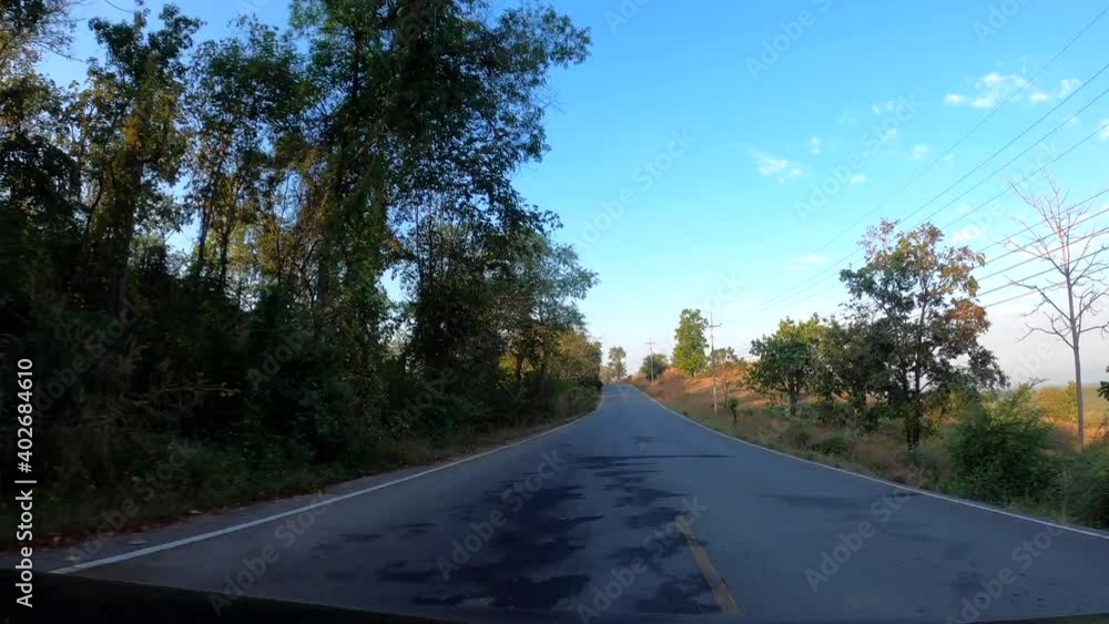 POV driving travel on the highway road with many curves among the forest at countryside of nan northern Thailand. POV driving travel on the highway road with many curves among the forest at countryside of nan northern Thailand.