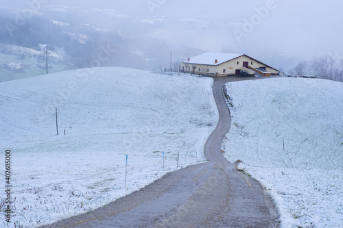 Snowy farmhouse in Lazkaomendi, Euskadi photo