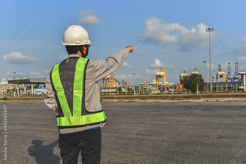 Worker in port planing work target in port, control loading Containers box to truck and logistic import export Business logistic concept Worker in port planing work target in port, control loading Containers box to truck and logistic import export Business logistic concept