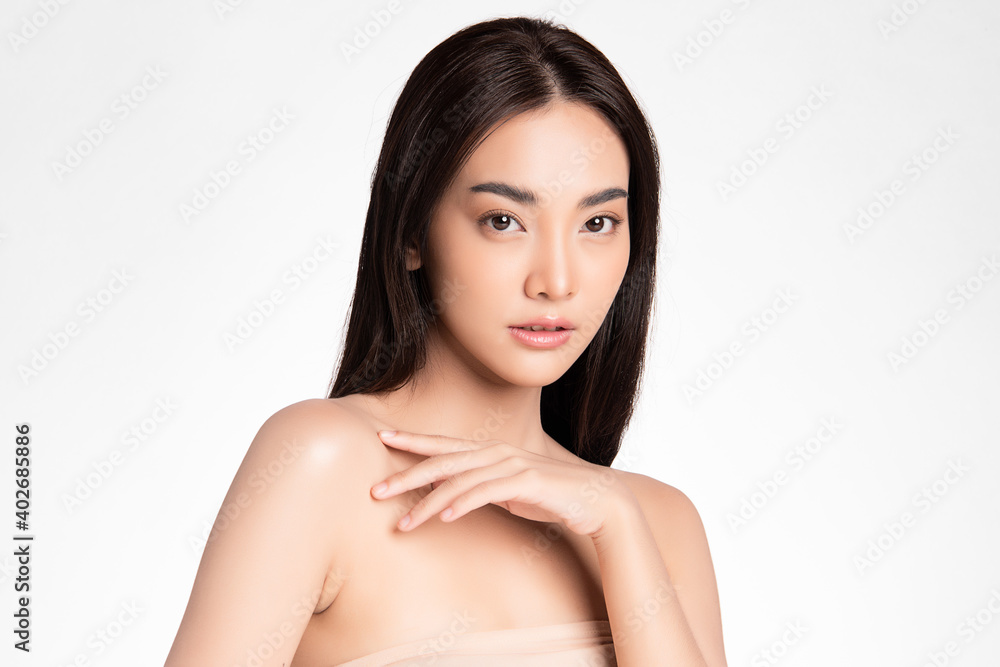 Beautiful Young asian Woman with Clean Fresh Skin, on Pink background, Face care, Facial treatment. Cosmetology, beauty and spa. Asian women portrait Beautiful Young asian Woman with Clean Fresh Skin, on Pink background, Face care, Facial treatment. Cosmetology, beauty and spa. Asian women portrait