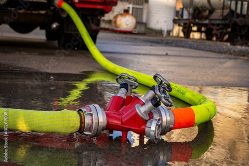 Viene Fire Department Firefighters set up supply lines to a Fire Engine in order to safeguard water pressure at there fire hoses