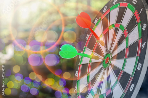 Dart arrow hitting target on Dartboard with bokeh, concept Business investment that rely on precision away be alert to success so game,