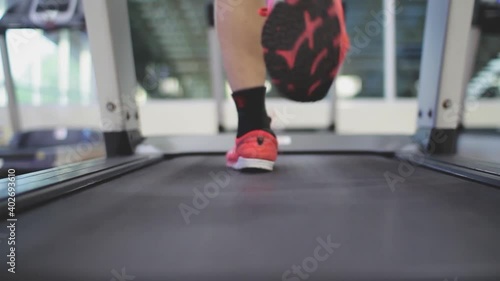 Running on a treadmill in fitness to lose weight