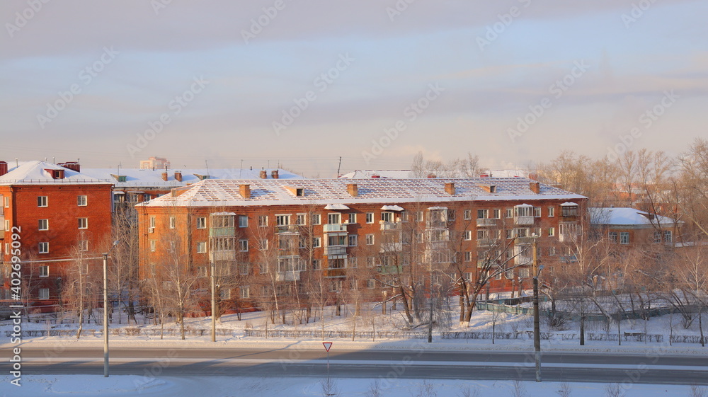 House with renovated roof. Winter city landscape.