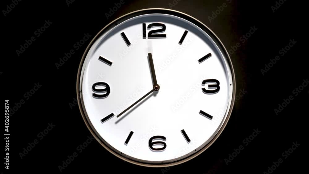 Time lapse movements of analog white face clock at 11:00 Time lapse movements of analog white face clock at 11:00