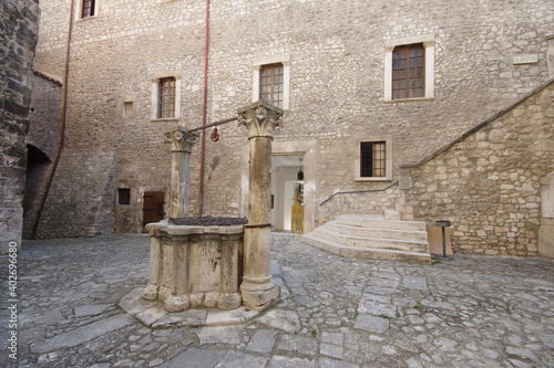 The ancient fifteenth-century well located in the courtyard of the Piccolomini Castle in Capestrano. photo