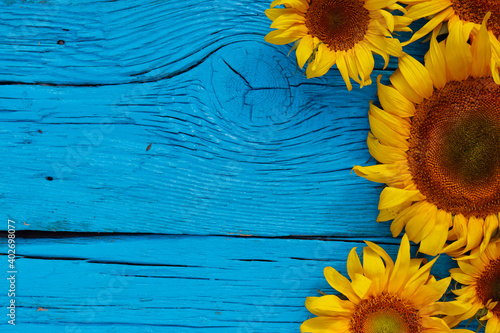 sunflowers on an old wooden background with copy space