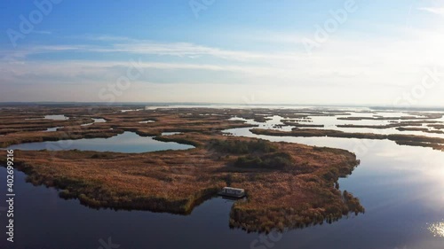 Irresistible floods on the Samara River on the Dnieper in Ukraine in the evening warm bright light. Aerial UHD 4K drone realtime video, shot in 10bit HLG and colorized