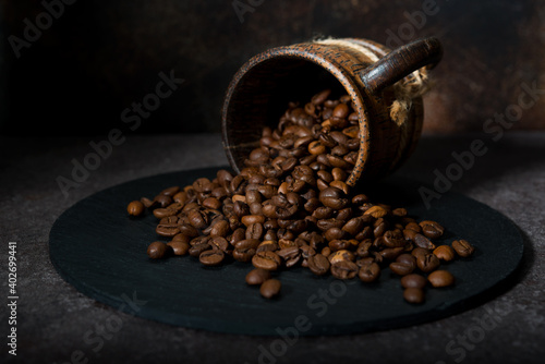 Roasted coffee beans on a dark background, close-up