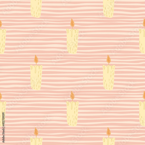 Scandy cozy seamless pattern with yellow pastel candles ornament. Pink striped background.