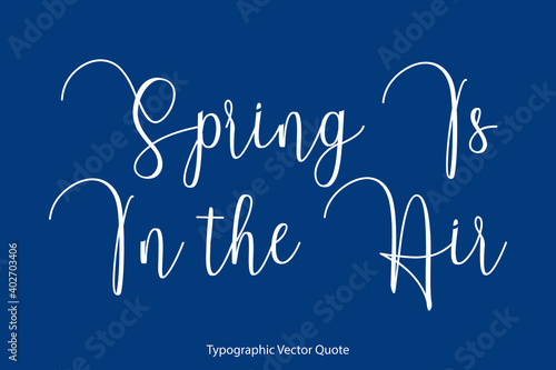 Spring Is In the Air Cursive Calligraphy Text on Blue Background