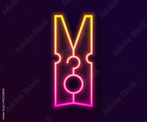 Glowing neon line Old wood clothes pin icon isolated on black background. Clothes peg. Vector.