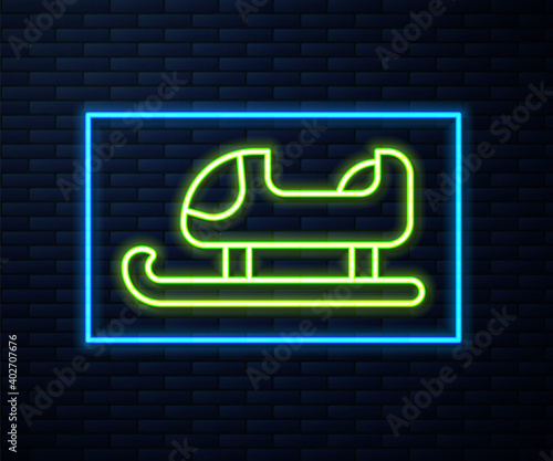 Glowing neon line Sled icon isolated on brick wall background. Winter mode of transport. Vector.