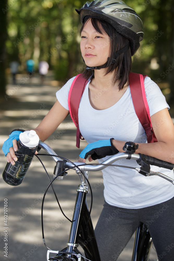 Naklejka premium woman biker with mountain bike
