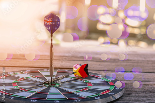 Darts hitting target on Dartboard with bokeh, concept Business investment that rely on precision away be alert to success so gameBundesdienstflaggeund Kriegsflagge. photo