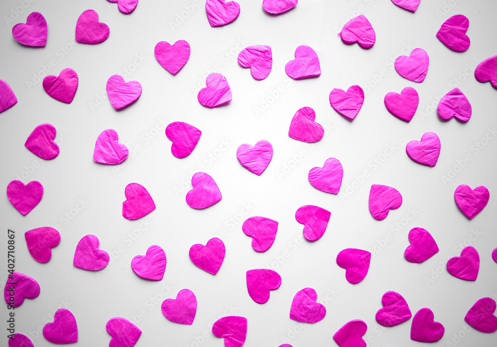 bright pink hearts confetti on white background