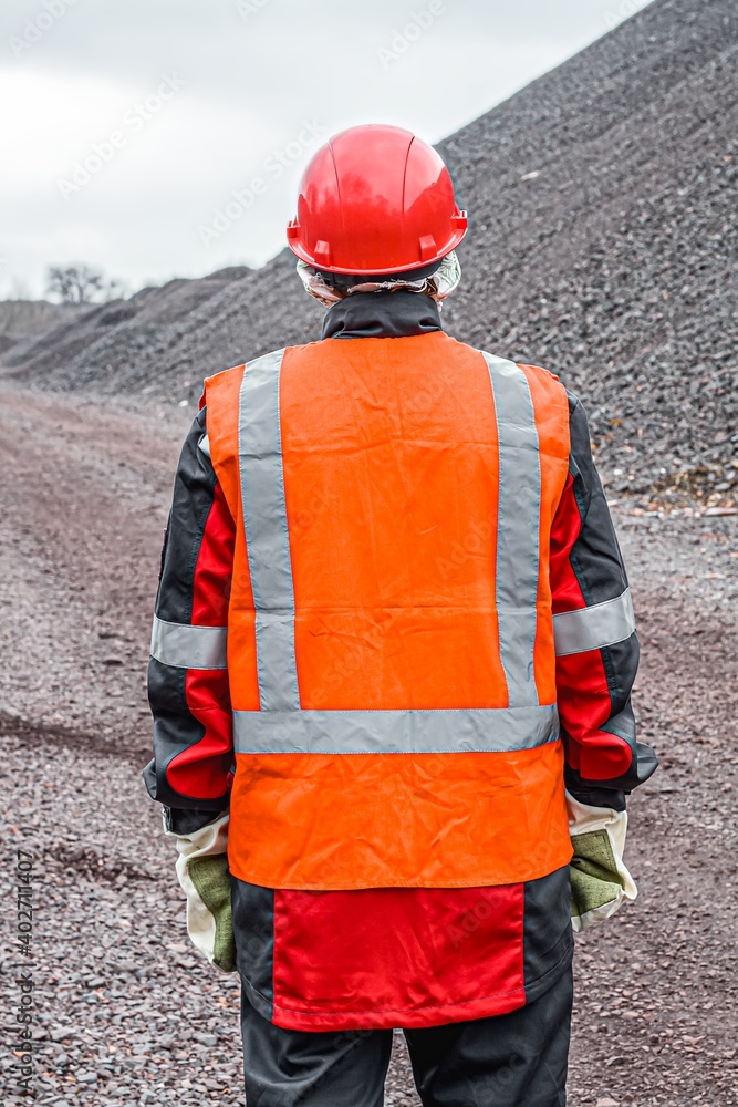 A helmet for protection of the head . Mining industry. A vest with a reflective strip. Labor protection