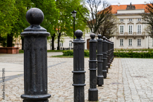 Black pillars on the sidewalk in the city..
