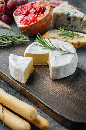 French camembert cheese, on gray background