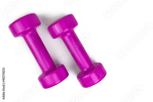 two pink dumbbell isolated on a white background, sports equipment, bodybuilding