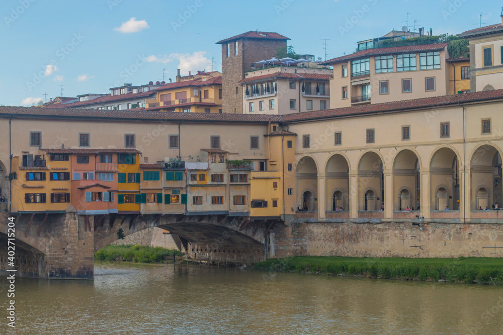 View of medieval stone bridge Ponte Vecchio and the Arno River from the Ponte Santa Trinita (Holy Trinity Bridge) in Florence, Tuscany, Italy. Florence is a popular tourist destination of Europe