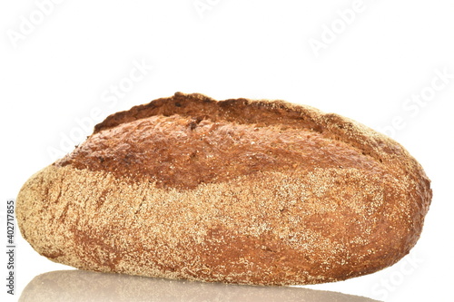 One loaf of aromatic buckwheat bread, close-up, isolated on white.