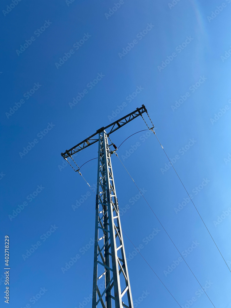 A power line on a power pole in Germany against a white sky A power line on a power pole in Germany against a white sky