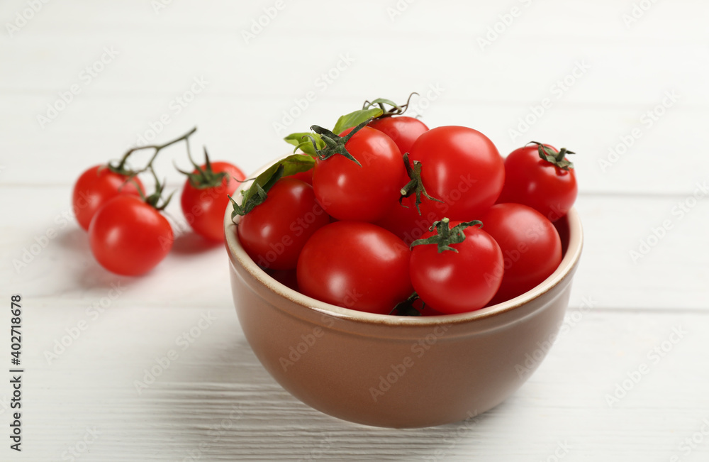Fresh ripe cherry tomatoes on white wooden table Fresh ripe cherry tomatoes on white wooden table