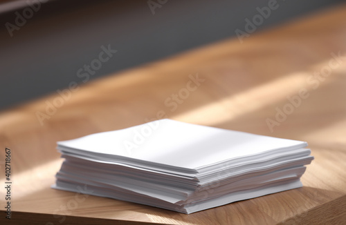 Stack of blank paper on wooden table indoors. Space for text