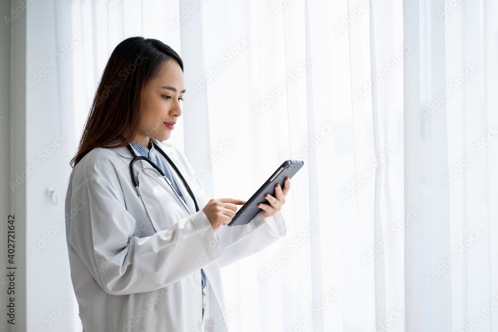 Asian medical doctor on white background standing wearing stethoscope white gown Asian medical doctor on white background standing wearing stethoscope white gown