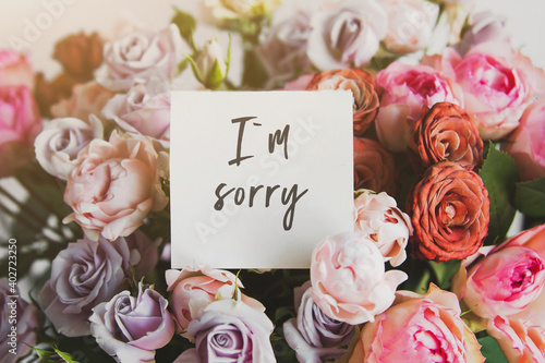 Картината върху платно white card for a bouquet with the inscription I am sorry in a bright beautiful b