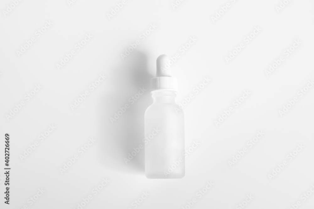 Hyaluronic acid bottle on a light background.. Hyaluronic acid bottle on a light background..
