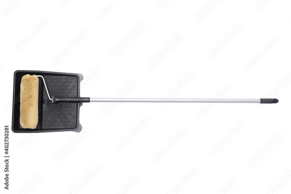 Paint roller and painting cuvette isolated on the white background. Paint roller and painting cuvette isolated on the white background.