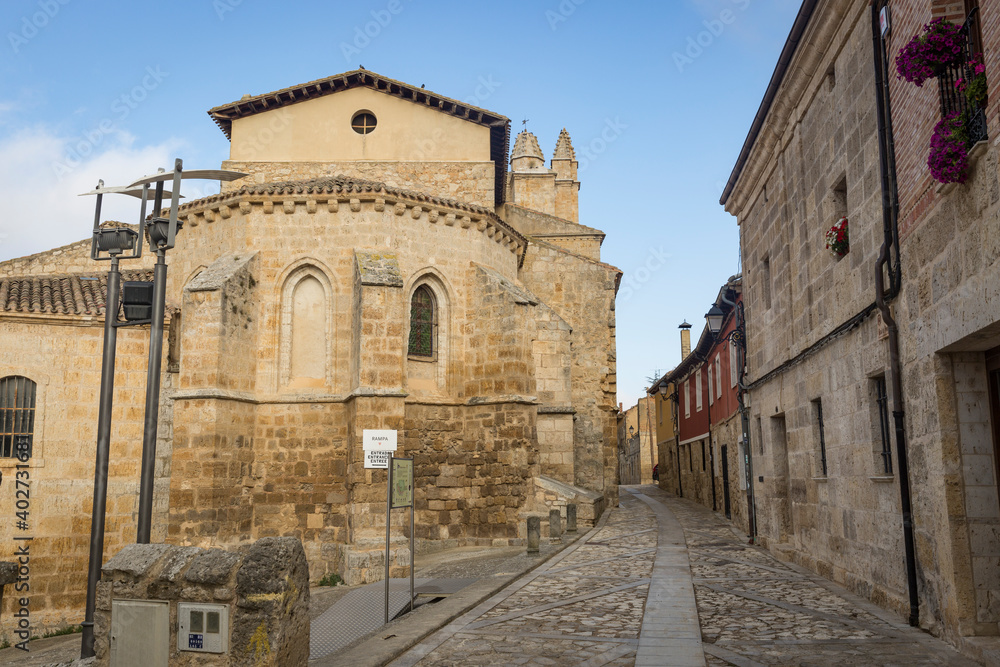 a cobbled street passing by the church of St John in Castrojeriz village, province of Burgos, Castile and Leon, Spain