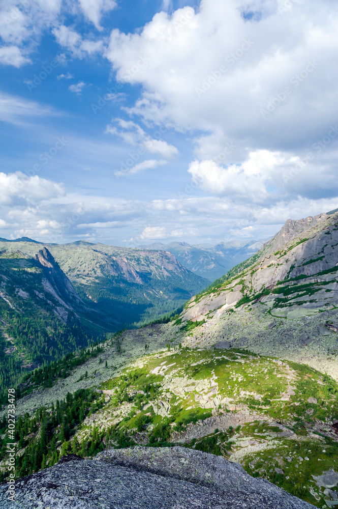 Taiga. Siberia. Mountain landscape with beautiful clouds in the deep sky. Ergaki. Western Sayan.