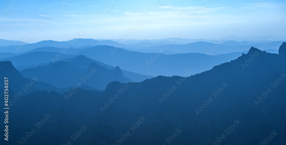 Taiga. Siberia. The geometry of the mountains in the rays of the sunset sun. Ergaki. Western Sayan.