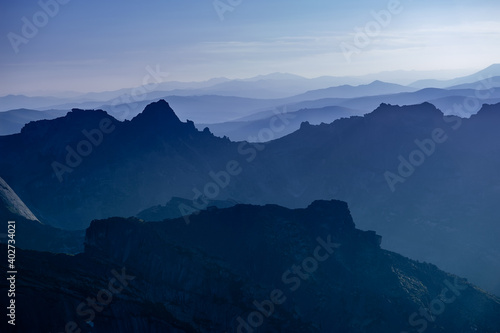 Taiga. Siberia. The geometry of the mountains in the rays of the sunset sun. Ergaki. Western Sayan.