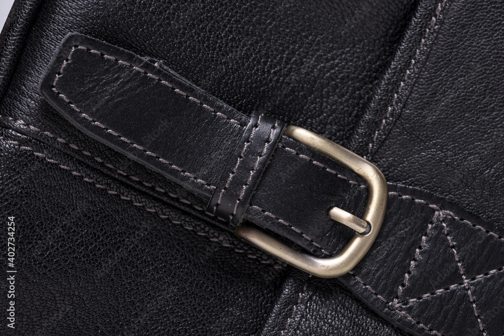 Blacl leather textured background with metal buckle Blacl leather textured background with metal buckle